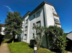 Hausansicht - Vermietete 3,5 Zimmer Wohnung mit Tageslichtbad und Garten!